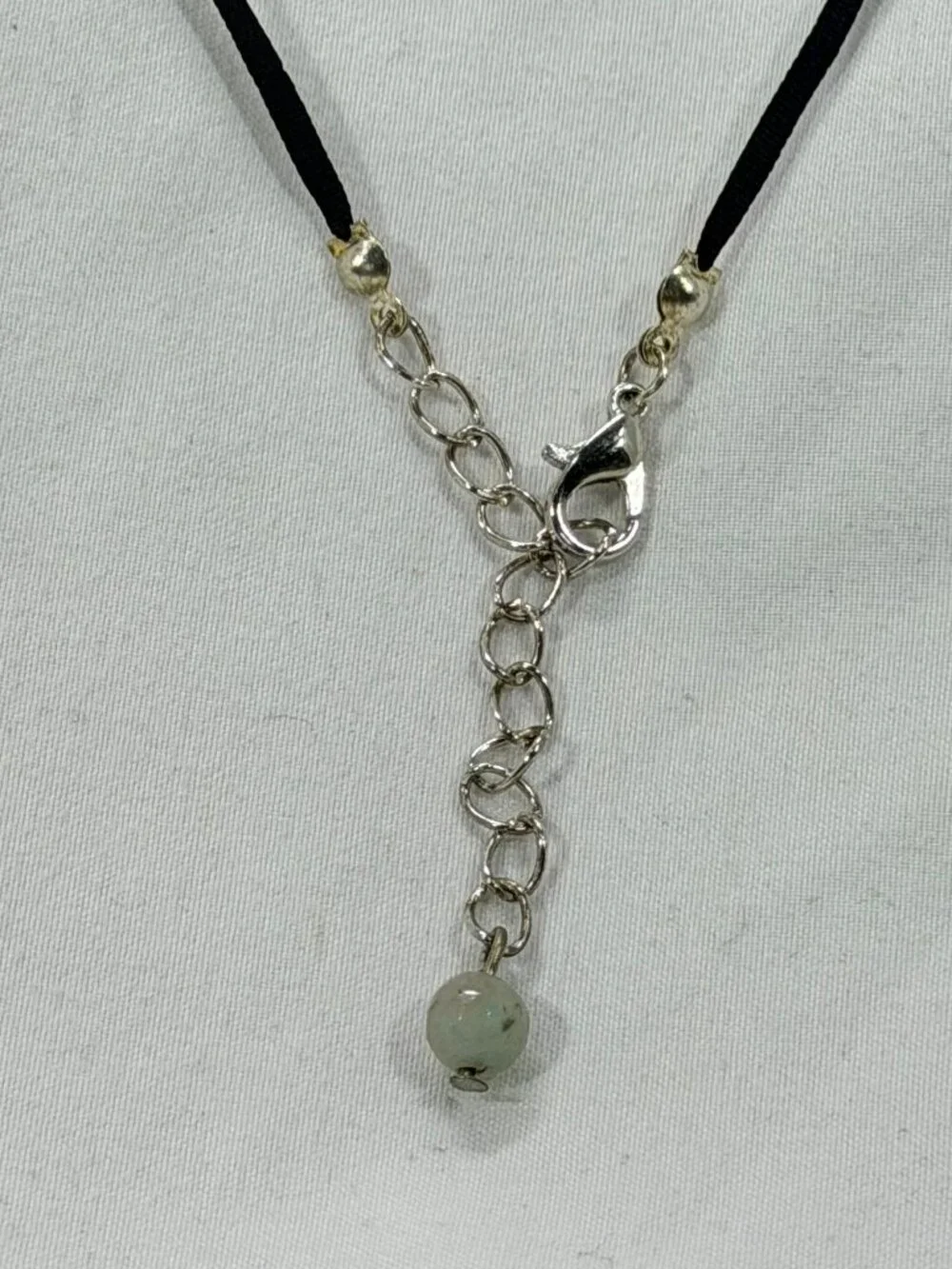 Elegant Silver and Black Necklace with an earthy colored bead